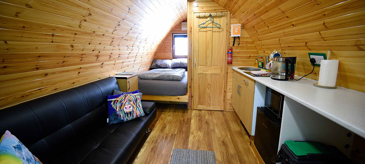 Our self catering Pods contain comfortable double bed en suite shower room comfortable seat and WIFI internet