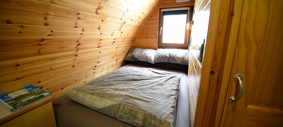 Dunvegan Camping Pods self catering accomodation contains a double bed with all bedding and linen provided