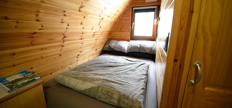 Dunvegan Camping Pods self catering accomodation contains a double bed with all bedding and linen provided