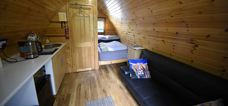Dunvegan Camping Pods contain comfortable double bed great couch and en suite shower room